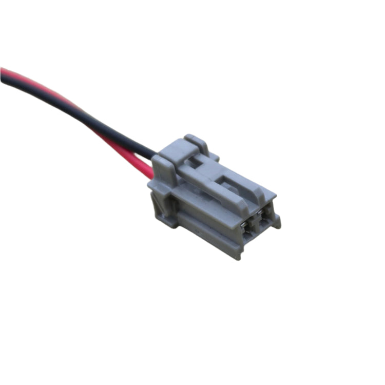 Electrical connector with red and black wires on a white background