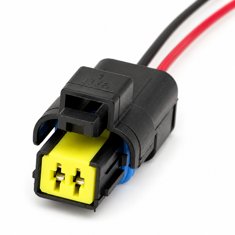 A black electrical connector with a bright yellow male plug and red and black wires extending from the back, shown on a white background.